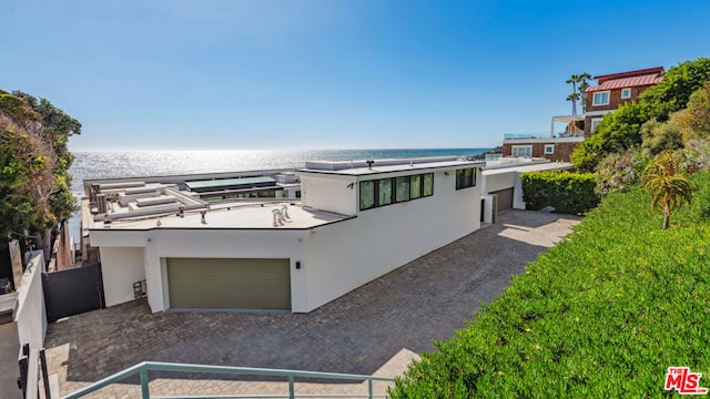 view of front of house featuring a view of the beach and a water view