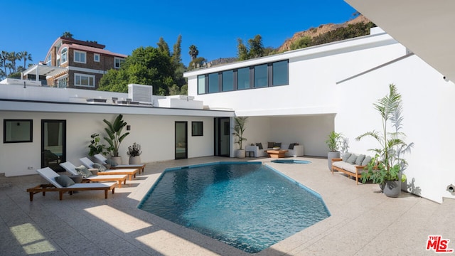 back of house featuring a patio