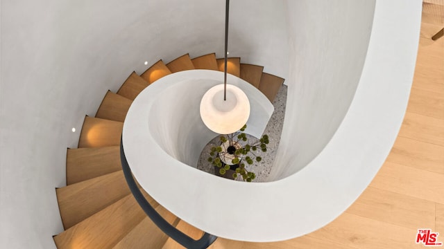 stairway featuring hardwood / wood-style floors