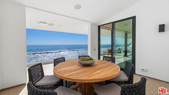 balcony with a beach view and a water view