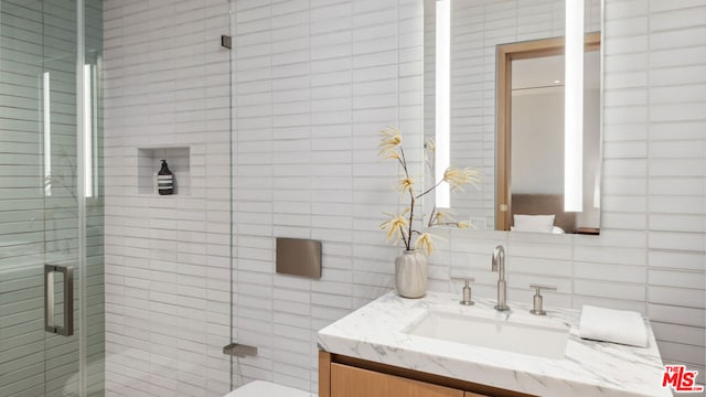 bathroom with vanity, toilet, and walk in shower