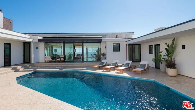 view of swimming pool with a patio area