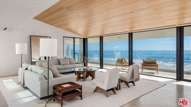 living room with a view of the beach, a water view, vaulted ceiling, and wooden ceiling