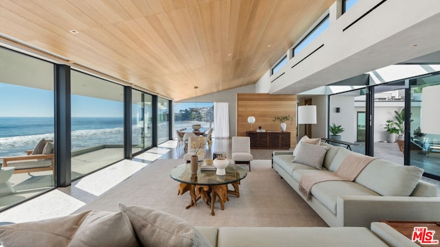 living room with a water view, a wall of windows, lofted ceiling, and wood ceiling