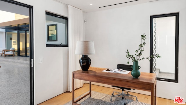 office area with wood-type flooring