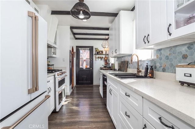 kitchen featuring sink, dark hardwood / wood-style flooring, beamed ceiling, white appliances, and white cabinets