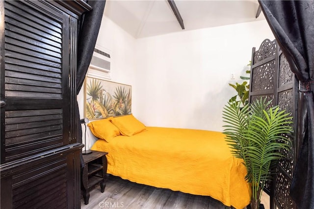 bedroom with hardwood / wood-style floors