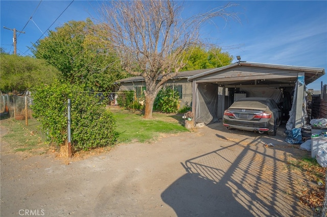 view of front of home with a carport