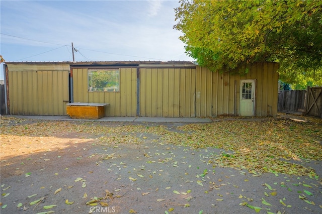 view of gate with a patio