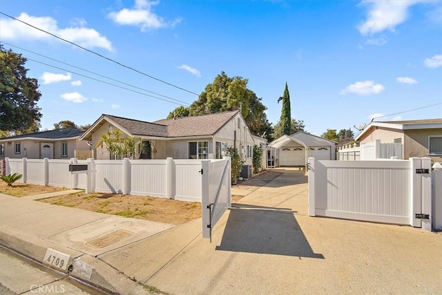 view of front of property with an outbuilding and a garage