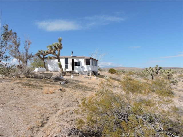 exterior space with a rural view