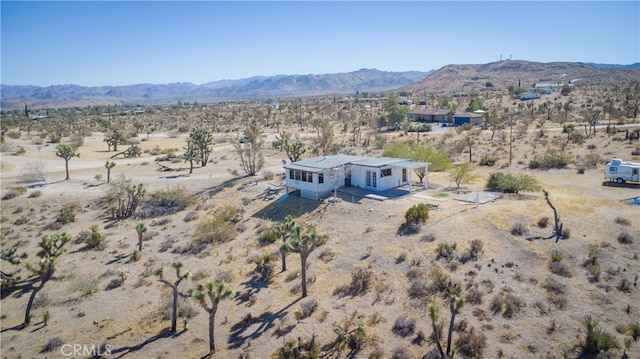 birds eye view of property featuring a mountain view