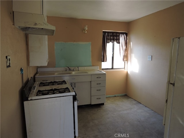 kitchen with white cabinetry, sink, and white appliances