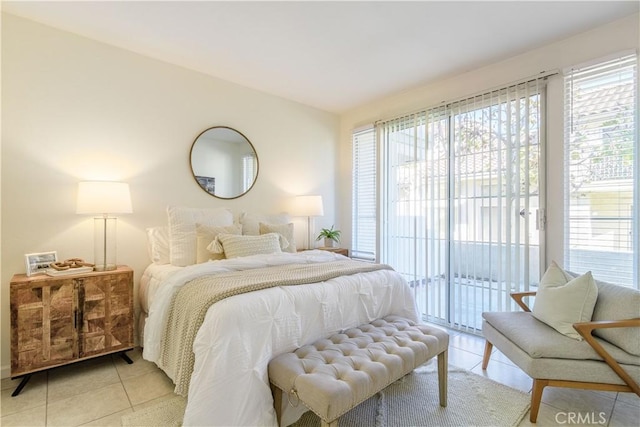 tiled bedroom featuring access to outside