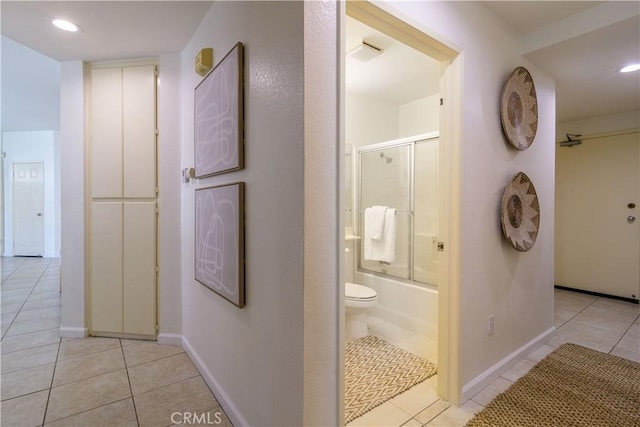 corridor featuring light tile patterned flooring