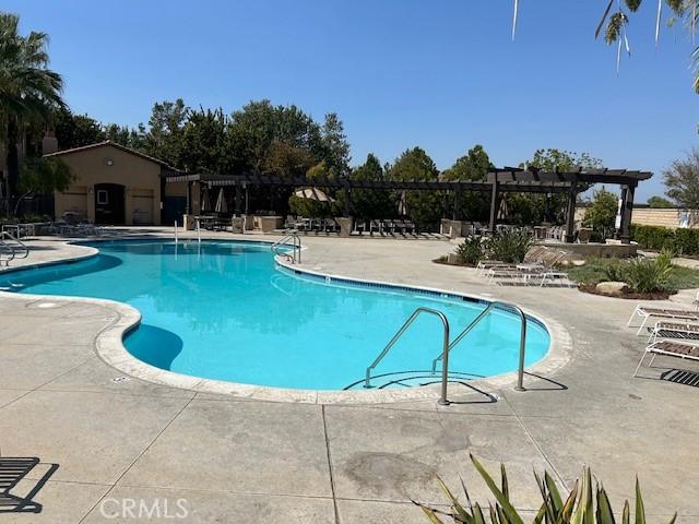 view of pool featuring a pergola and a patio area