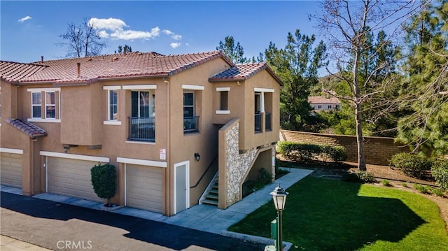 mediterranean / spanish home featuring a garage