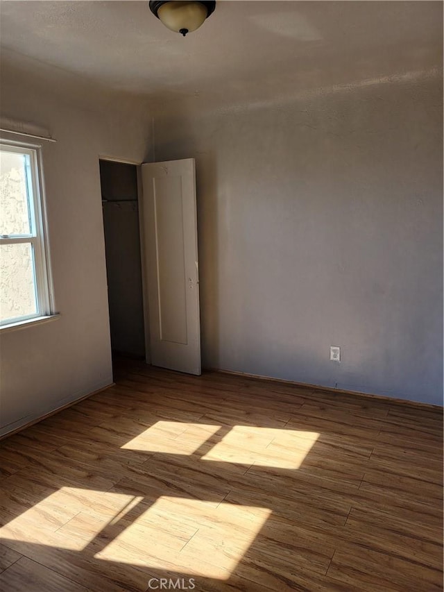 unfurnished room with light hardwood / wood-style flooring