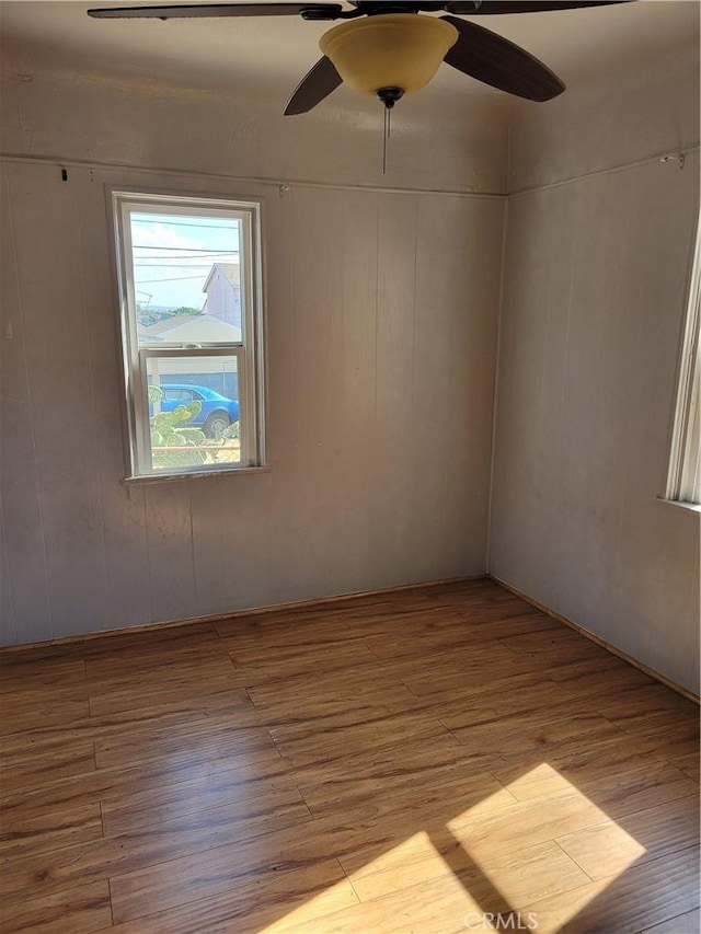 unfurnished room with light hardwood / wood-style flooring