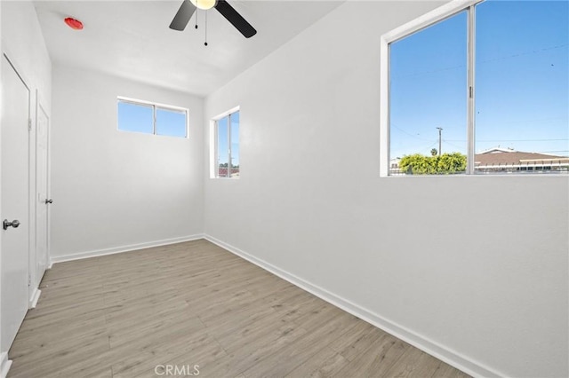 spare room featuring ceiling fan and light hardwood / wood-style flooring