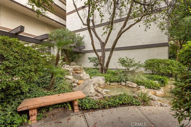 5987 Peacock Ridge Rd Unit 101, Rancho Palos Verdes, CA 90275 - view of yard featuring a garden pond
