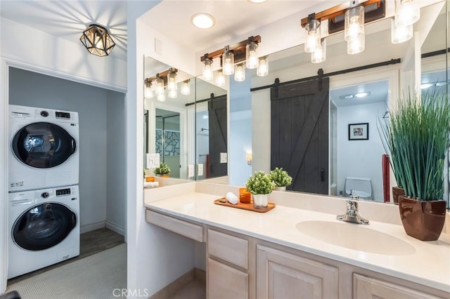 5987 Peacock Ridge Rd Unit 101, Rancho Palos Verdes, CA 90275 - bathroom with stacked washer and clothes dryer and vanity