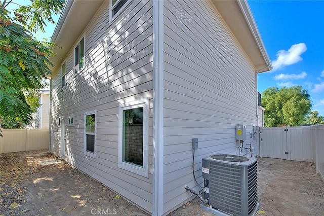 view of side of property featuring central air condition unit