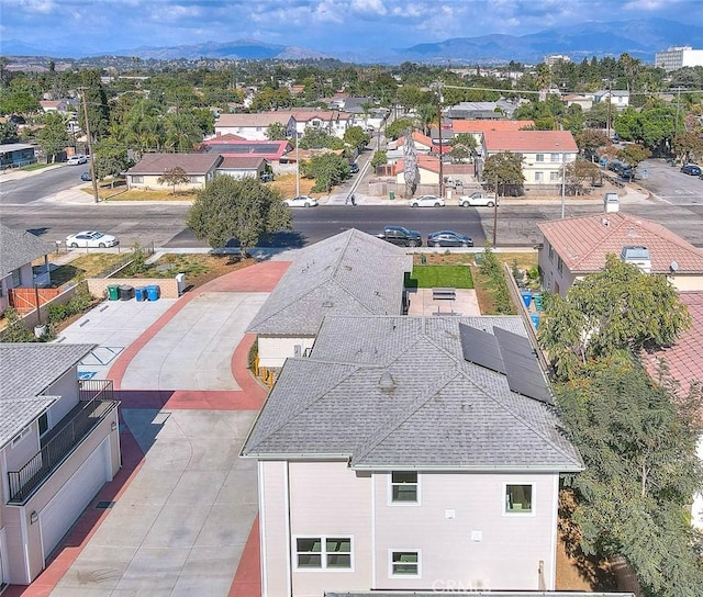 birds eye view of property with a mountain view