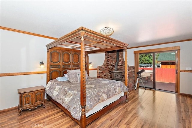 bedroom featuring crown molding and hardwood / wood-style flooring