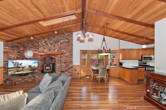 living room featuring a wood stove, wooden ceiling, high vaulted ceiling, beamed ceiling, and hardwood / wood-style floors