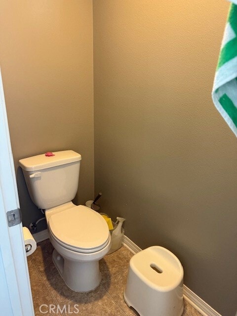 bathroom featuring tile patterned floors and toilet