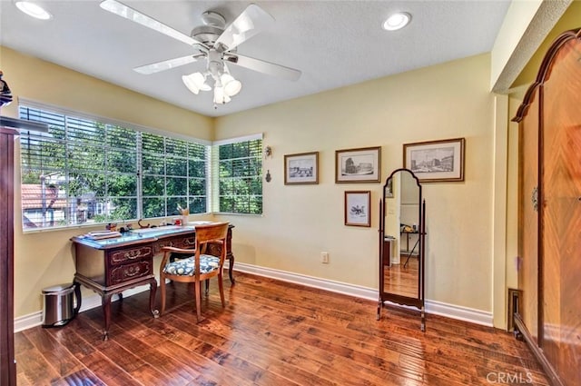 home office featuring ceiling fan, dark hardwood / wood-style flooring, and a healthy amount of sunlight