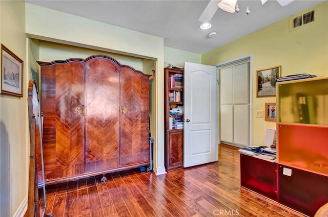 office space with ceiling fan and wood-type flooring