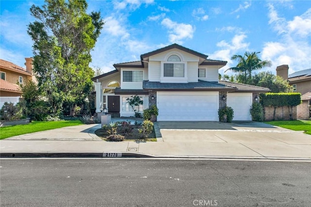 front of property with a garage