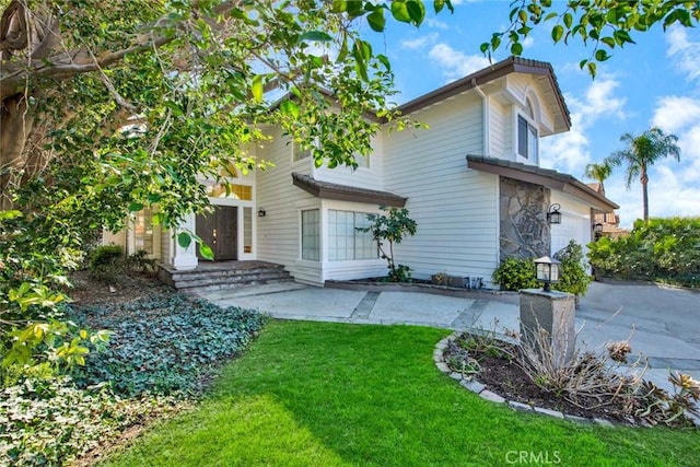 rear view of house with a lawn