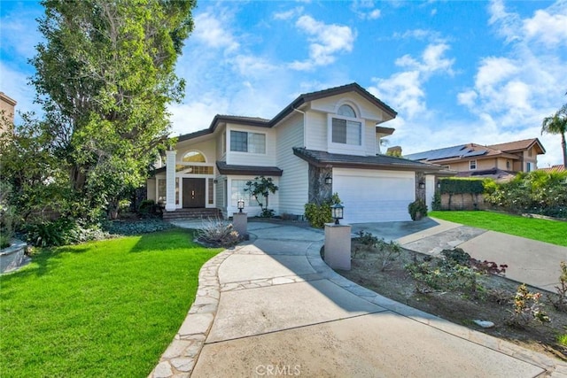 view of front property featuring a garage and a front yard