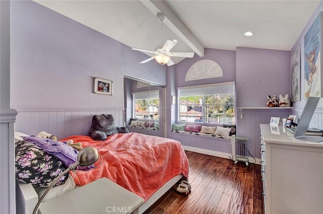 bedroom with radiator, ceiling fan, dark wood-type flooring, and lofted ceiling with beams