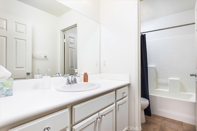 full bathroom featuring tile patterned floors, vanity, toilet, and shower / tub combo