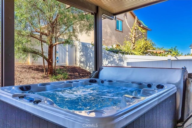 exterior details featuring a hot tub