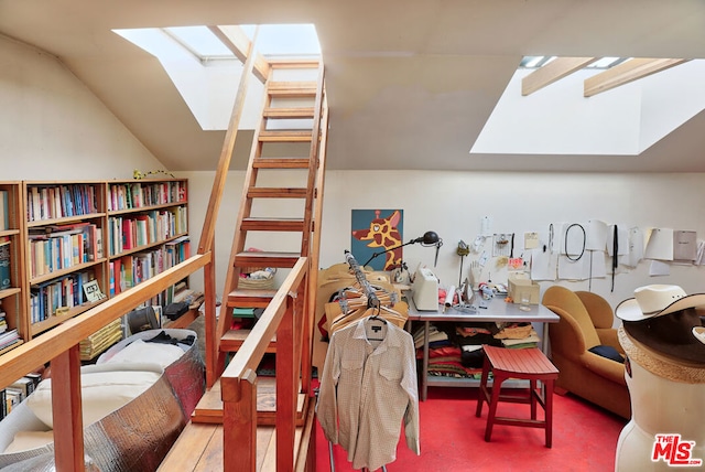 interior space featuring a workshop area and lofted ceiling