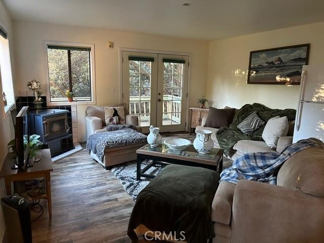 494 Delle Dr, Crestline, CA 92325 - living area featuring plenty of natural light, french doors, wood finished floors, and a wood stove