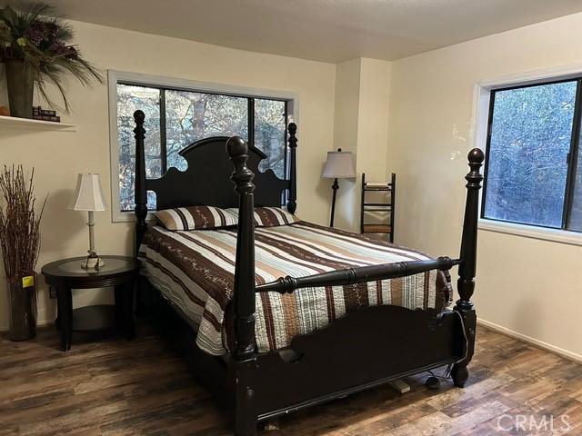 bedroom featuring wood-type flooring