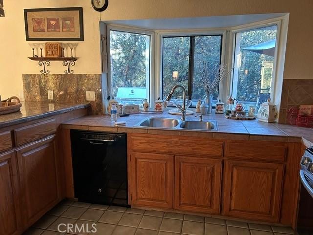 494 Delle Dr, Crestline, CA 92325 - kitchen featuring dishwasher, a sink, brown cabinetry, tile countertops, and light tile patterned flooring