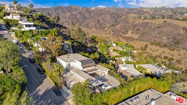 drone / aerial view featuring a mountain view