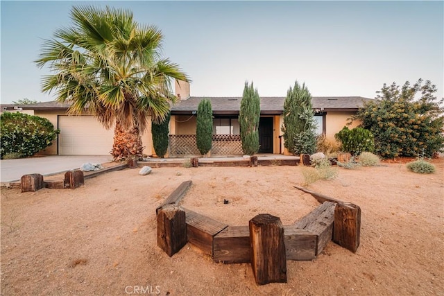 single story home featuring a garage