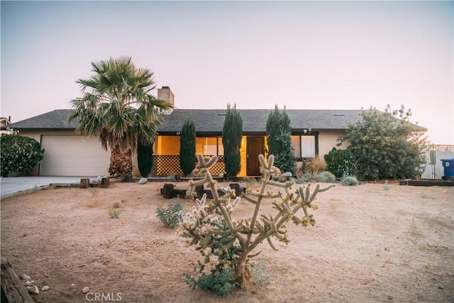 single story home with a garage