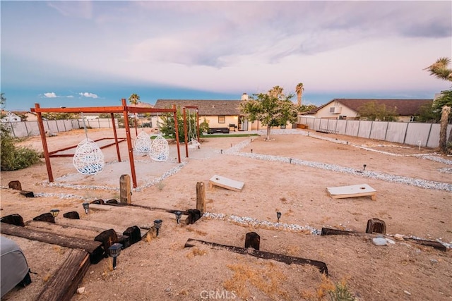 view of yard at dusk