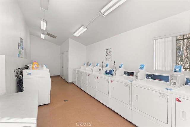 clothes washing area featuring separate washer and dryer