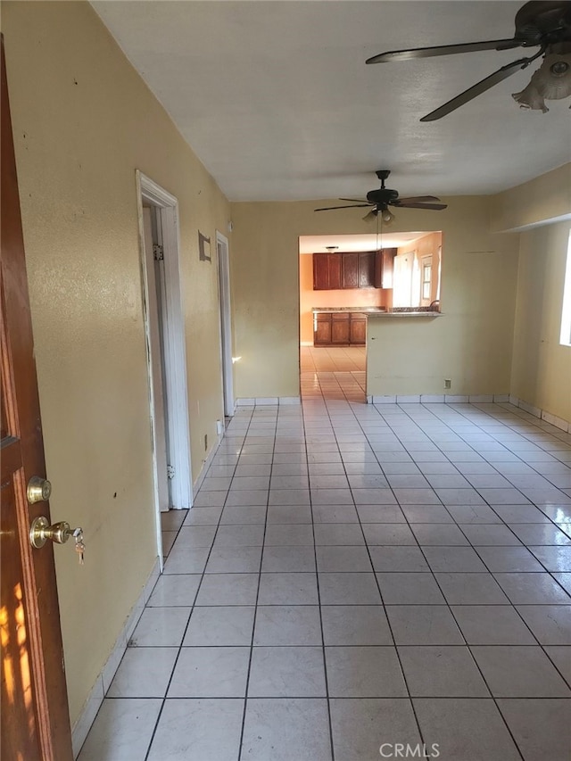 unfurnished living room with light tile patterned floors