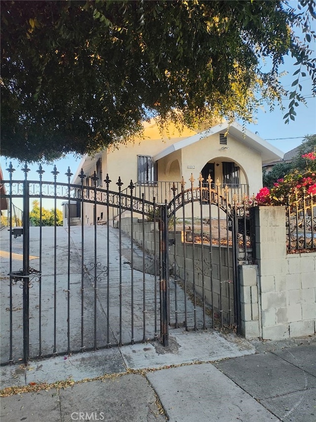 view of gate at dusk